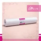 Podkład kosmetyczny jednorazowy z włókniny 80 cm x 50 m QMS Line Extra do salonu kosmetycznego